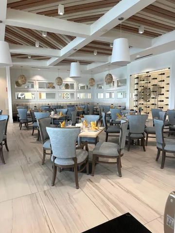 a view of a living room and chandelier
