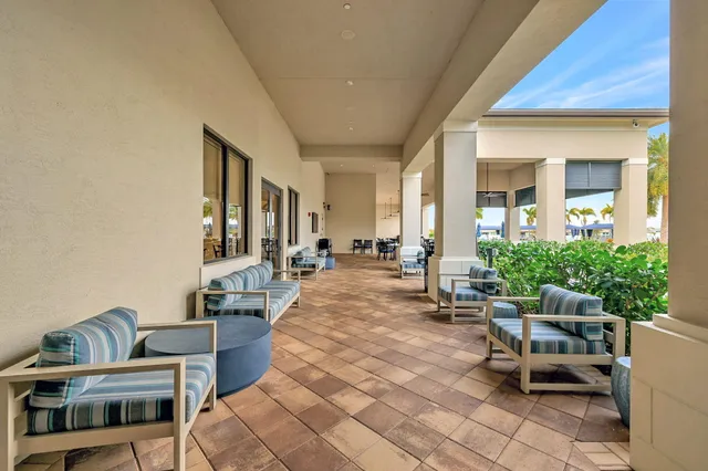 a view of swimming pool with outdoor seating and plants