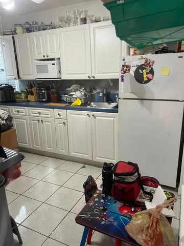 a kitchen with stainless steel appliances a sink and a stove