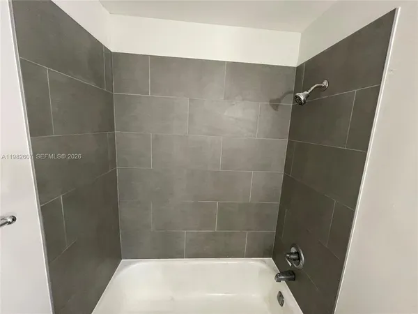 a bathroom with a sink vanity mirror and toilet