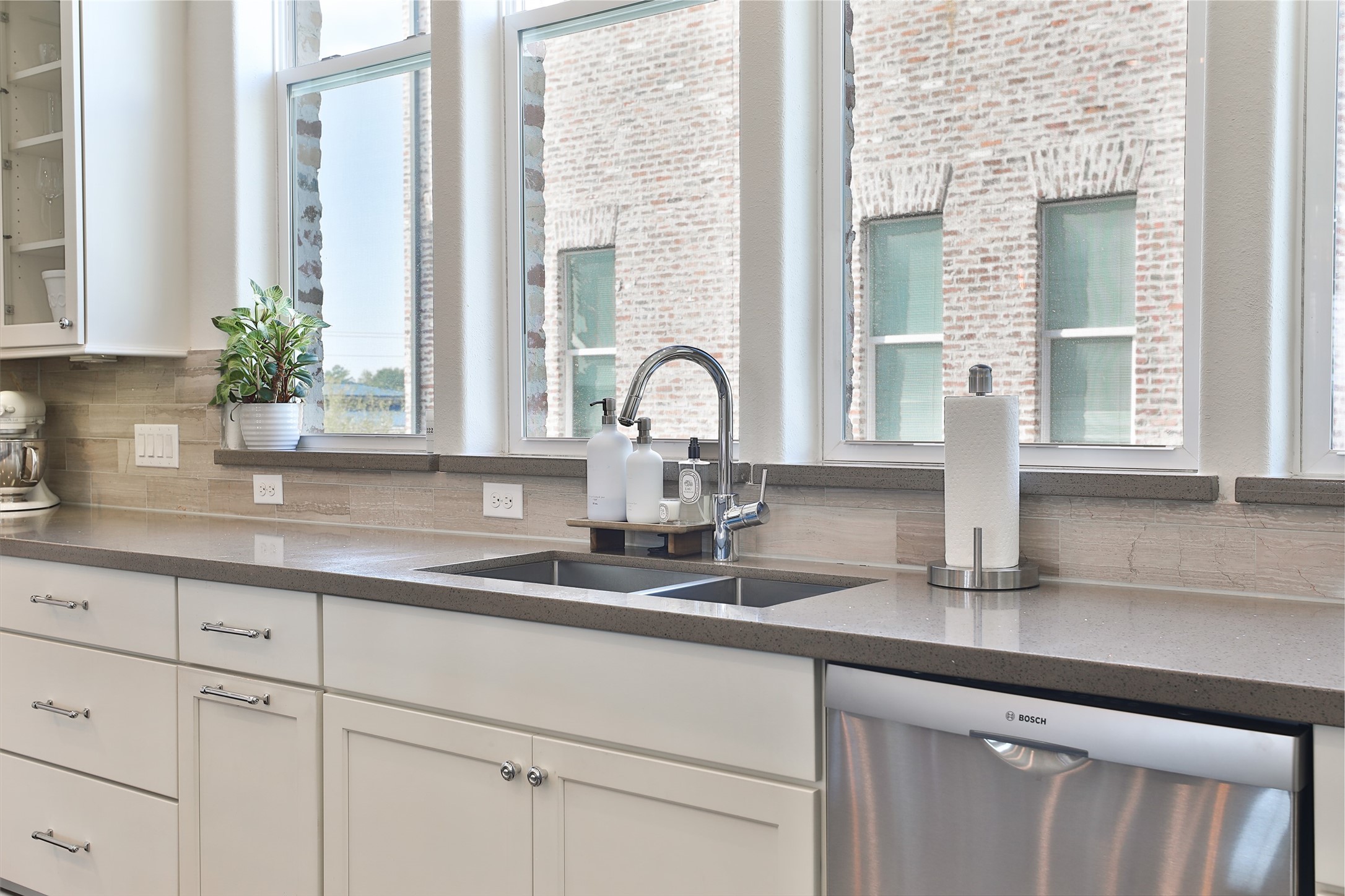 2303 Kolbe Run Lane Houston, TX 77080 - Photo 11 of 35 Discover tranquility in the kitchen with an under mount sink that becomes a Zen retreat, as the warm glow of the setting sun streams through.