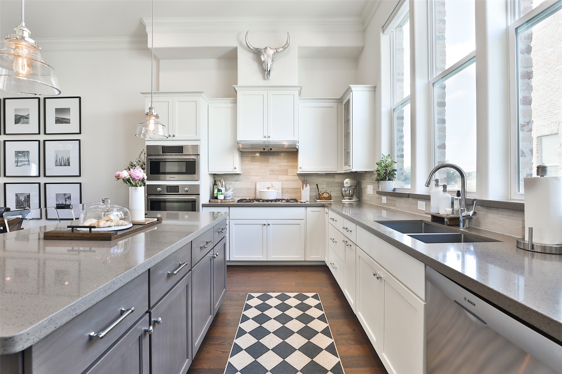 2303 Kolbe Run Lane Houston, TX 77080 - Photo 12 of 35 This kitchen exudes understated timeless beauty with its warm, two-toned cabinets, creating an inviting and elegant atmosphere flanked by the Bosch stainless appliances and understated hardware.