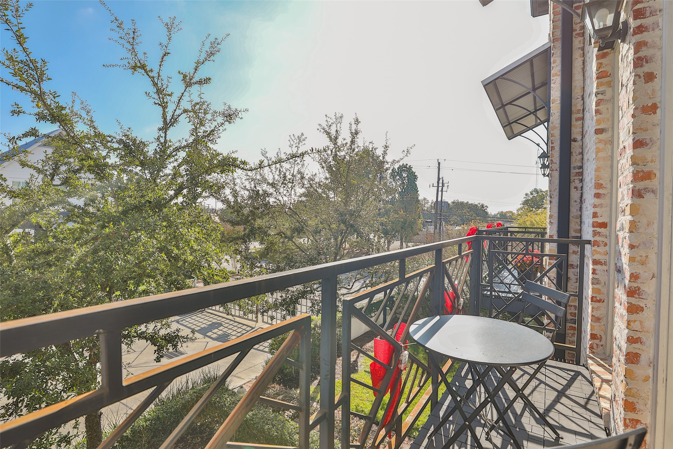 2303 Kolbe Run Lane Houston, TX 77080 - Photo 19 of 35 Experience serene second-floor views from a stylish balcony adorned with designer iron railings.