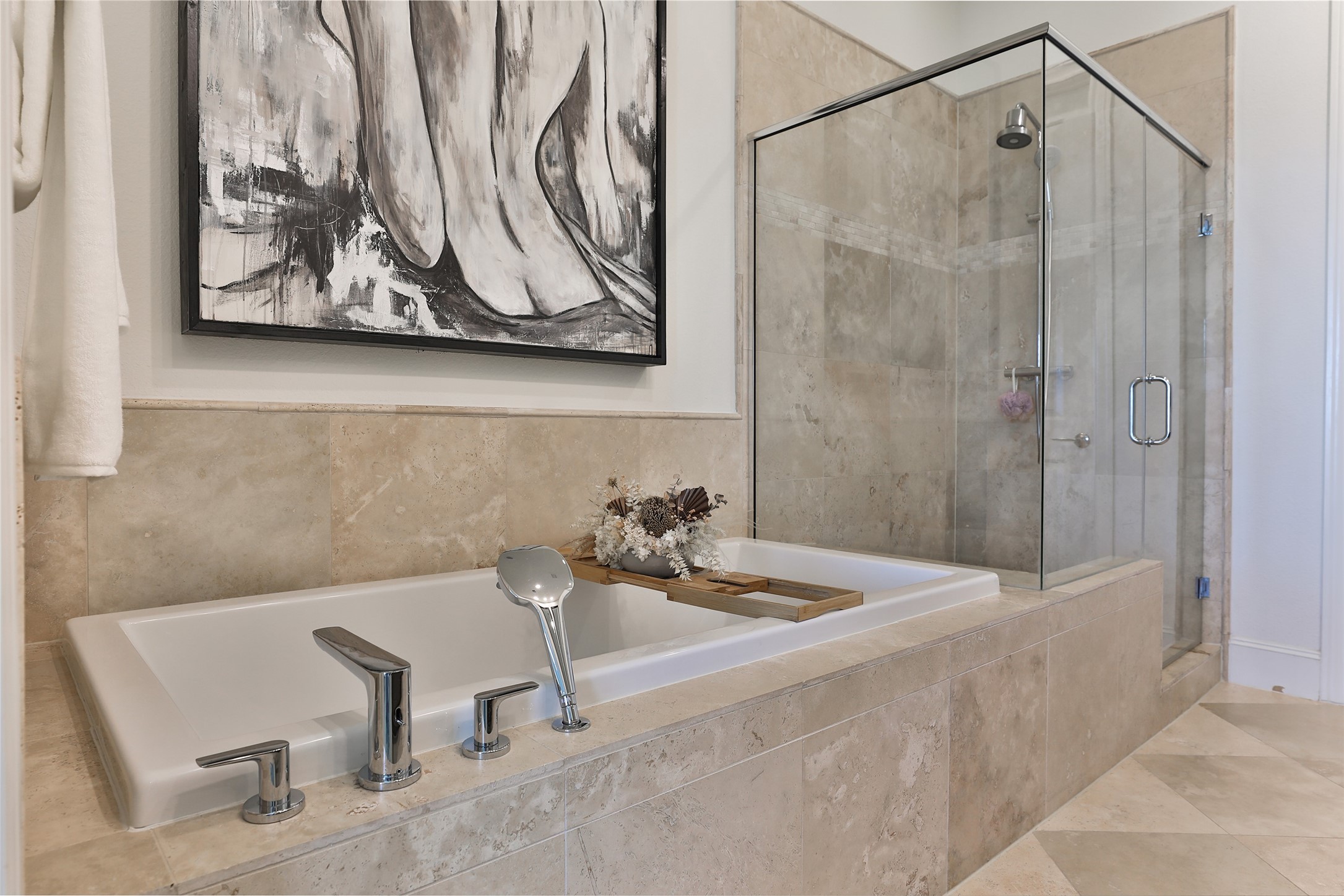 2303 Kolbe Run Lane Houston, TX 77080 - Photo 25 of 35 This bathroom features a luxurious soaking tub with modern fixtures, a glass-enclosed shower, and elegant tile work.