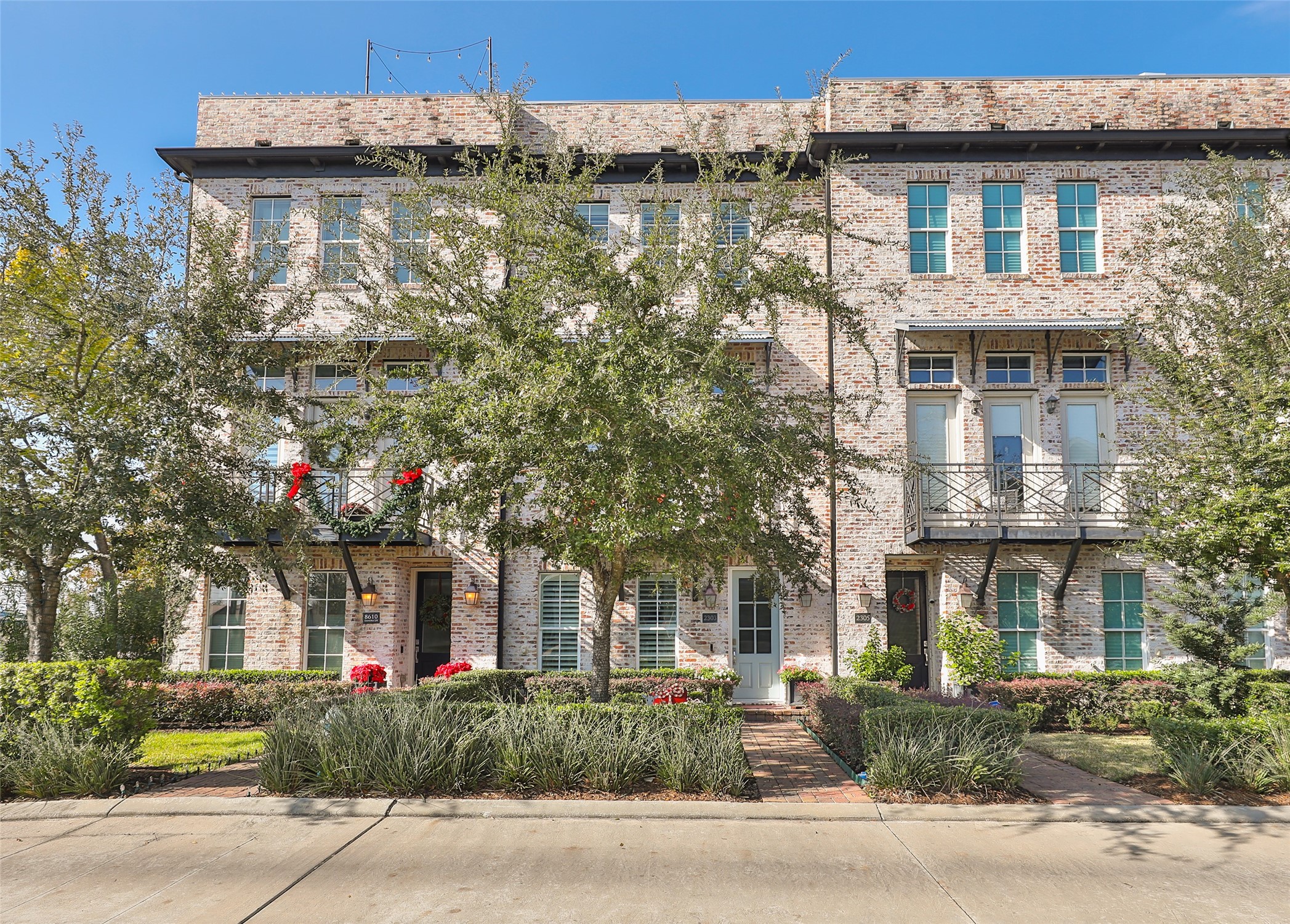 2303 Kolbe Run Lane Houston, TX 77080 - Photo 34 of 35 Nestled behind a charming facade, this home greets you with an inviting front entry framed by lush oak trees, offering a perfect blend of elegance and nature.