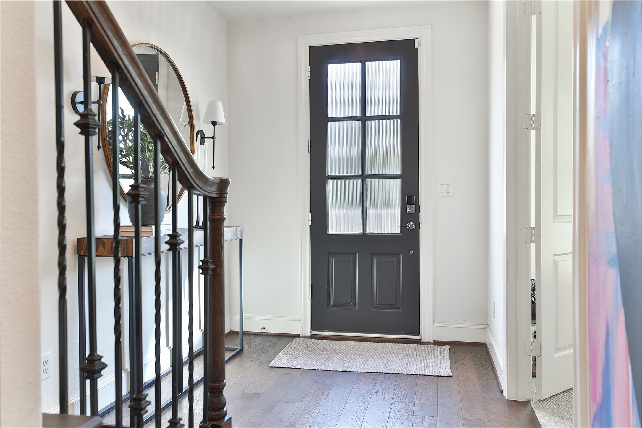 2303 Kolbe Run Lane Houston, TX 77080 - Photo 5 of 35 Step into this warm and welcoming entryway, where the elegant staircase and stylish accents instantly make you feel at home.
