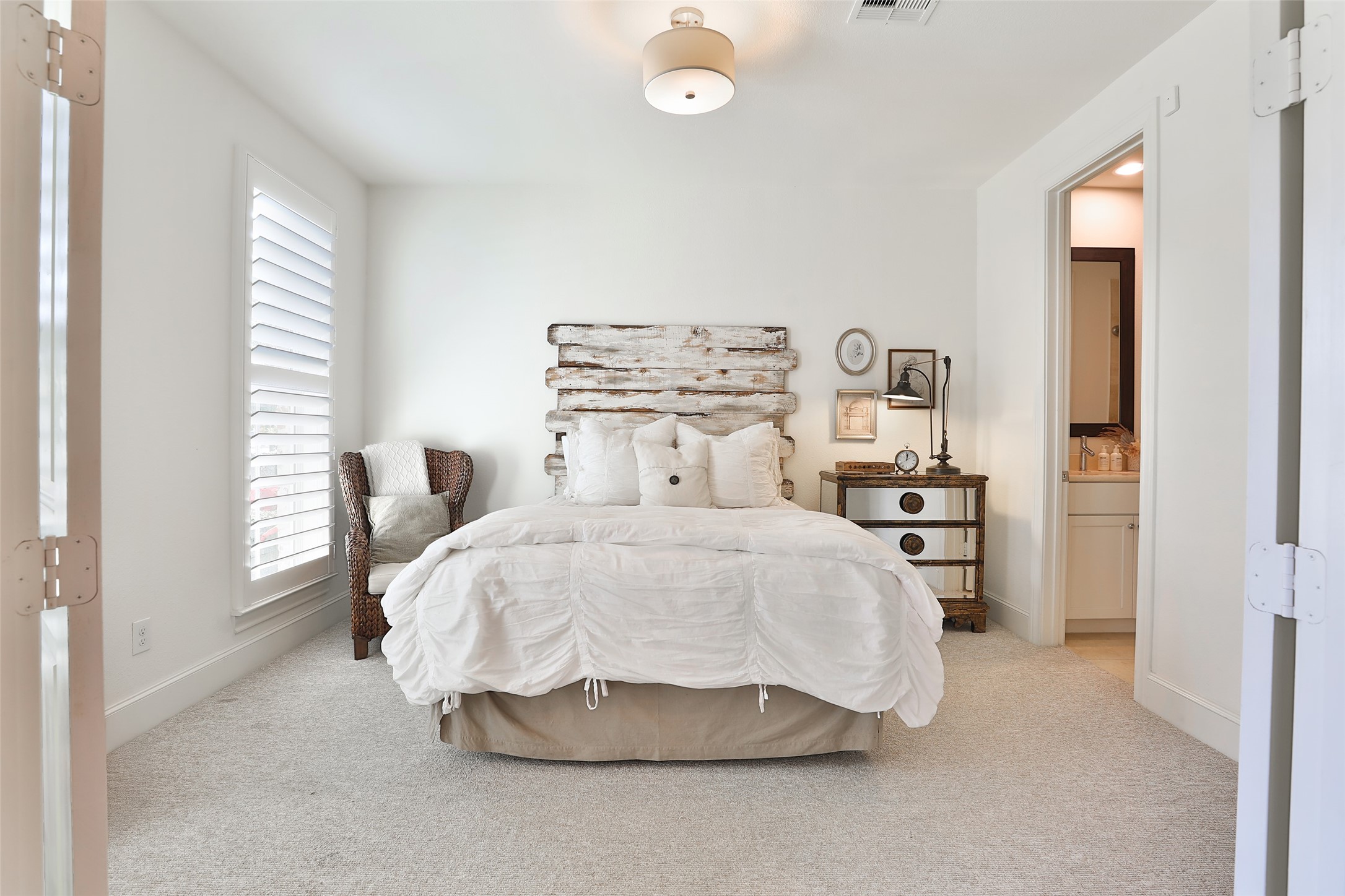 2303 Kolbe Run Lane Houston, TX 77080 - Photo 8 of 35 This inviting first-floor ensuite, with its cozy, rustic charm and bright ambiance, is perfectly designed to welcome holiday guests in style.