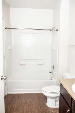 a view of a patio with a table and chairs