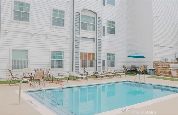 a view of kitchen with sink and cabinets