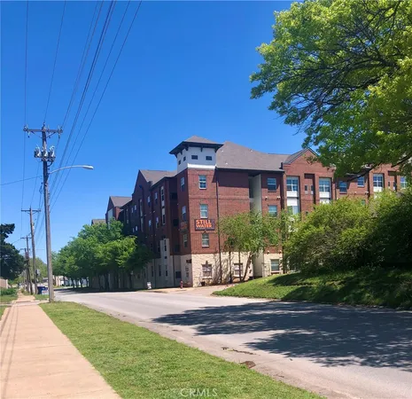 a view of a building with a yard