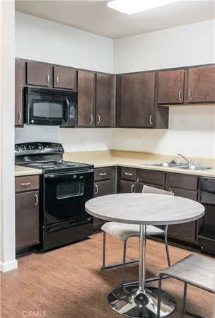 a kitchen with a stove and a microwave