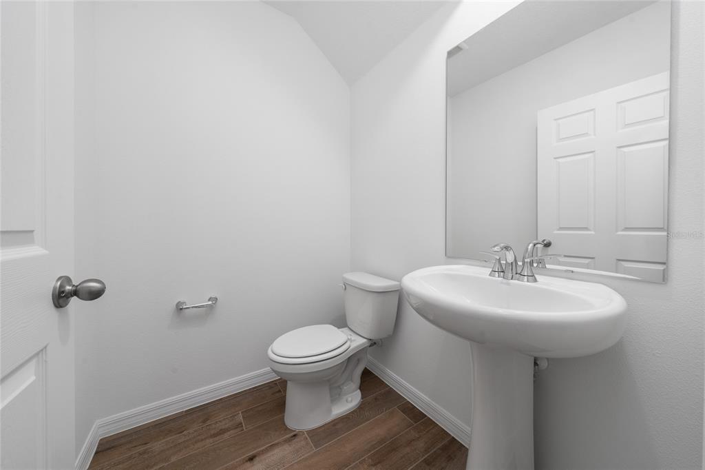 4272 Ranch House Road St. Cloud, FL 34772 - Photo 14 of 29 a bathroom with a sink toilet and a mirror