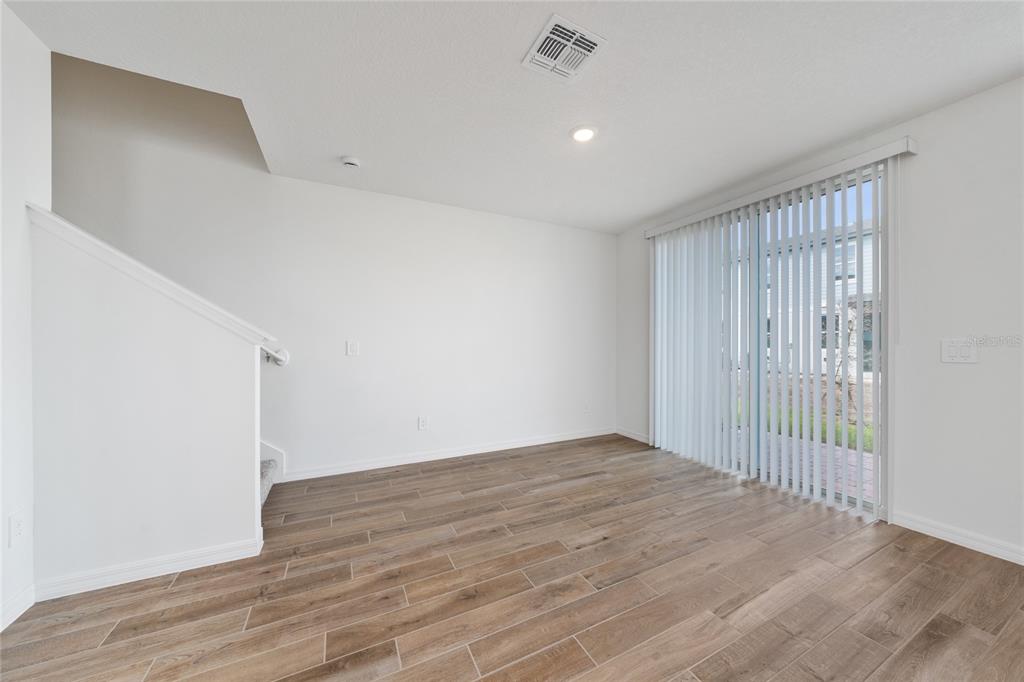 4272 Ranch House Road St. Cloud, FL 34772 - Photo 15 of 29 a view of empty room with wooden floor