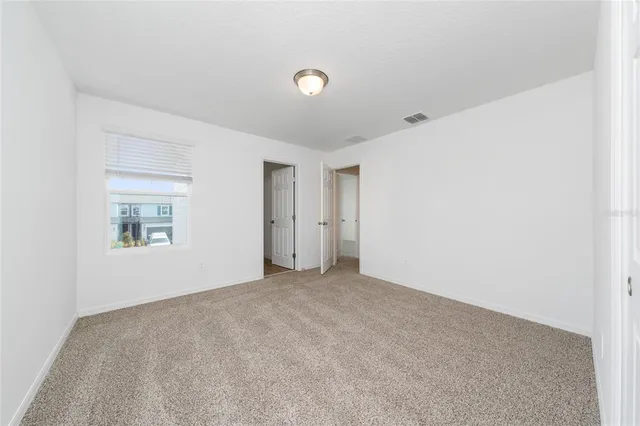 a bathroom with a double vanity sink toilet and shower