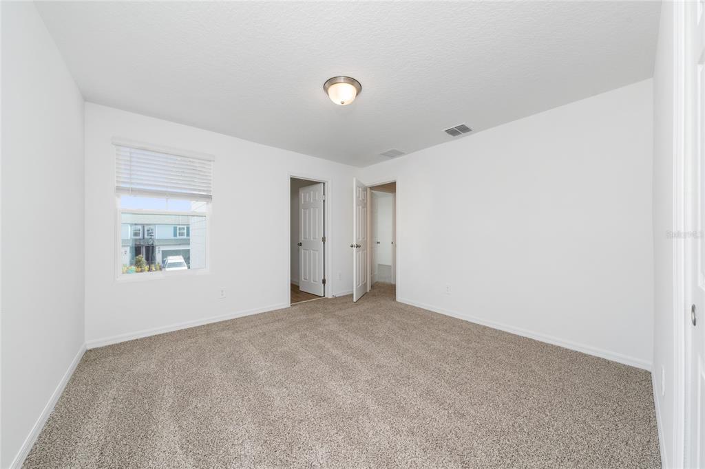 4272 Ranch House Road St. Cloud, FL 34772 - Photo 21 of 29 a view of an empty room with a window