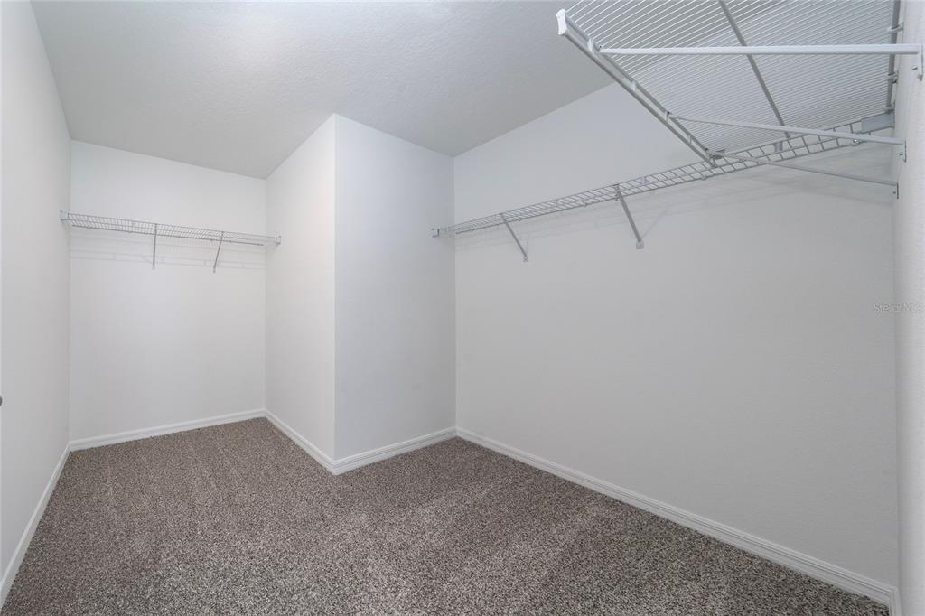 4272 Ranch House Road St. Cloud, FL 34772 - Photo 27 of 29 a view of a room with racks on the wall