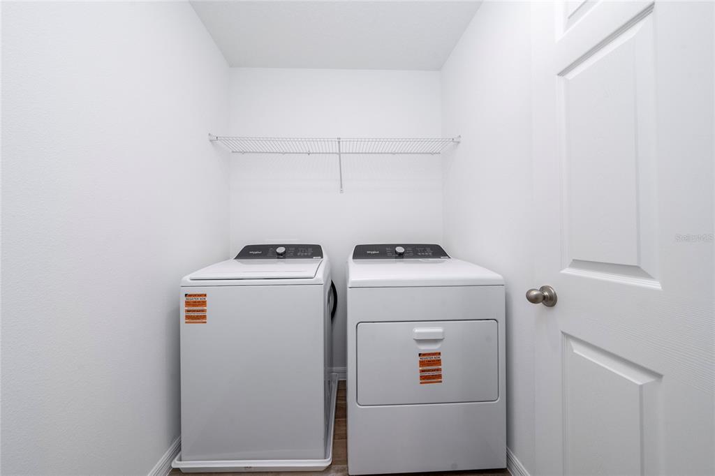 4272 Ranch House Road St. Cloud, FL 34772 - Photo 28 of 29 a utility room with dryer and washer