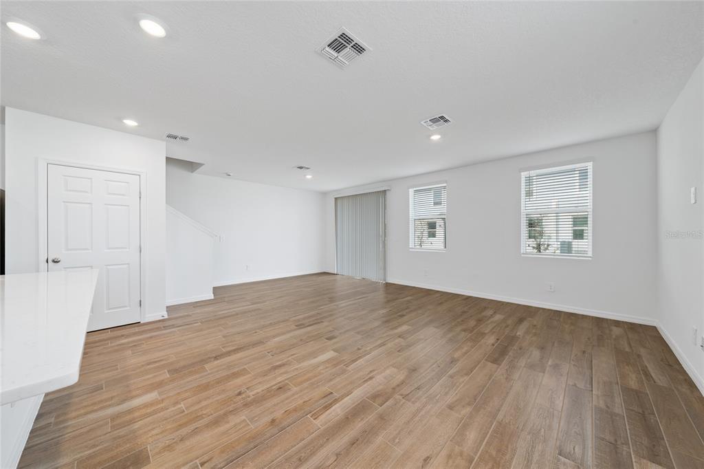 4272 Ranch House Road St. Cloud, FL 34772 - Photo 10 of 29 a view of empty room with wooden floor and fan