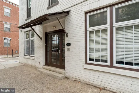 a front view of a house with glass windows