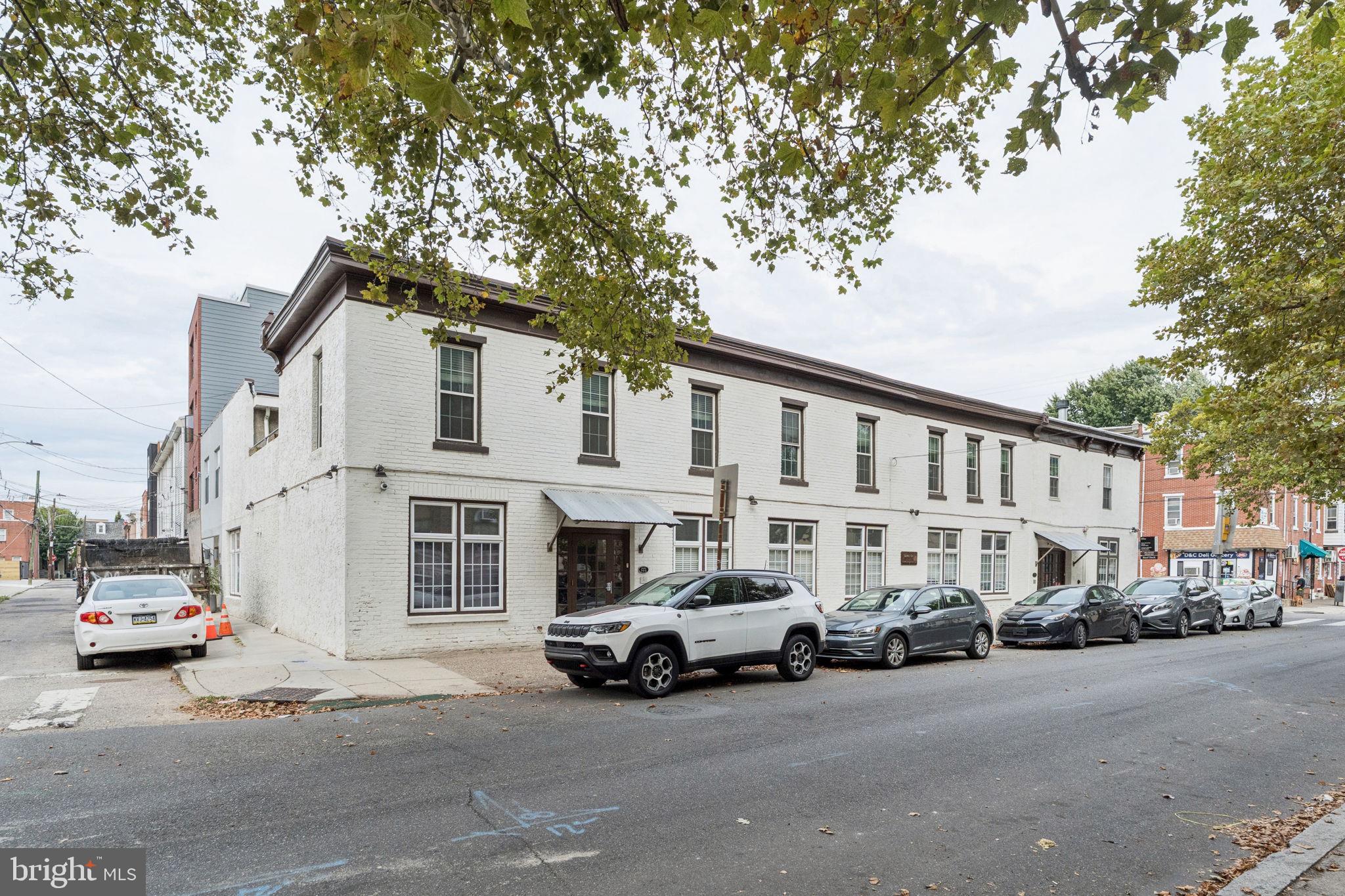 1246 East Montgomery Avenue, Unit 5 Philadelphia, PA 19125 - Photo 18 of 18 a white house that has a tree in front of it