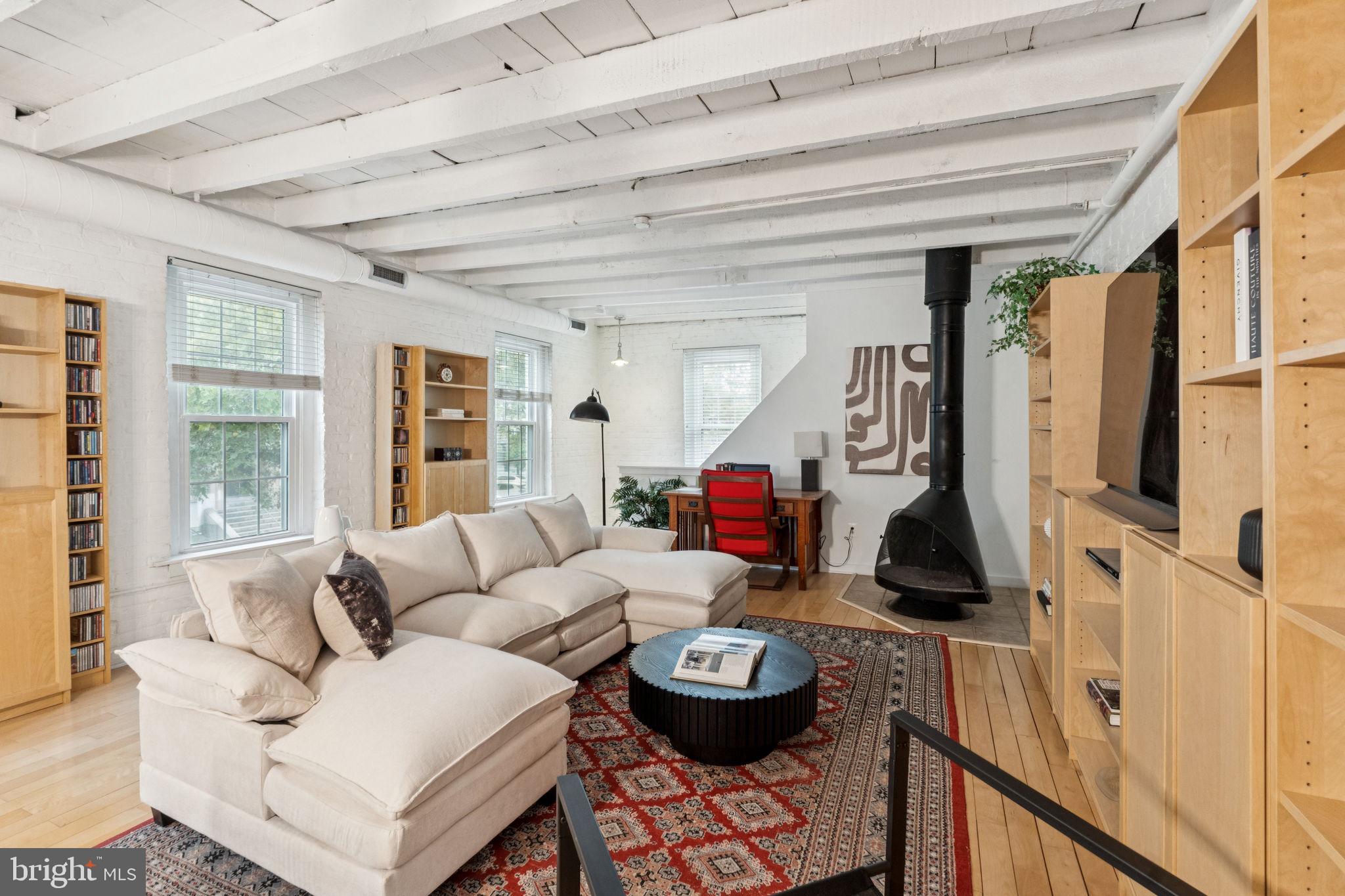 1246 East Montgomery Avenue, Unit 5 Philadelphia, PA 19125 - Photo 3 of 18 a living room with furniture and a large window