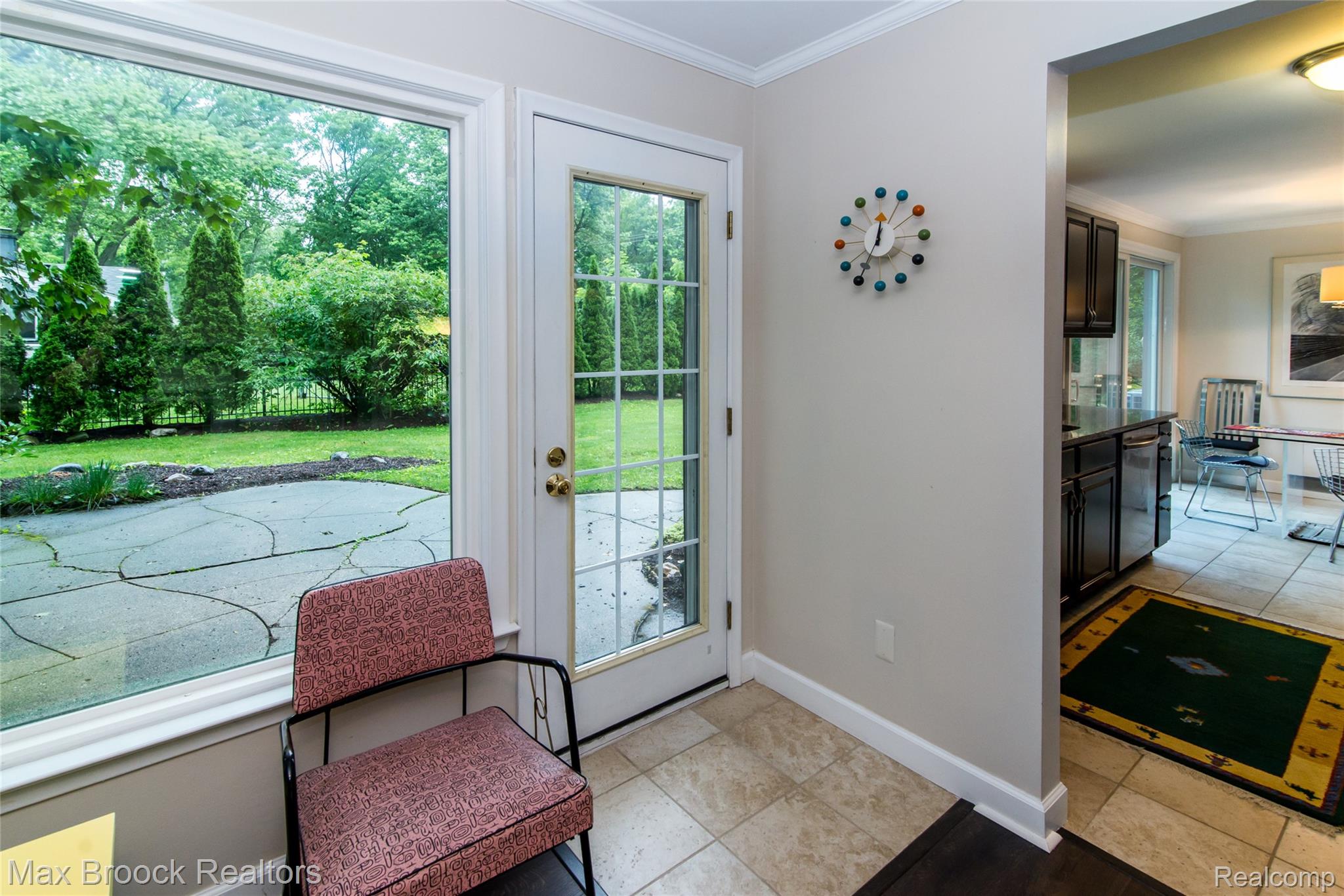 6799 East Dartmoor Road West Bloomfield, MI 48322 - Photo 14 of 36 Bright interior space with large windows and a glass-paneled exterior door