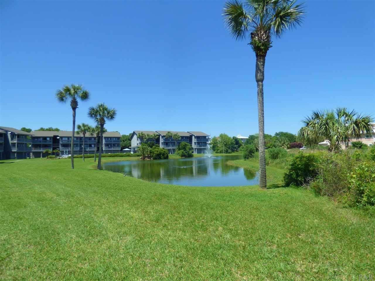 200 Pensacola Beach Road, Unit B8 Gulf Breeze, FL 32561 - Photo 2 of 2 a view of a lake and a yard