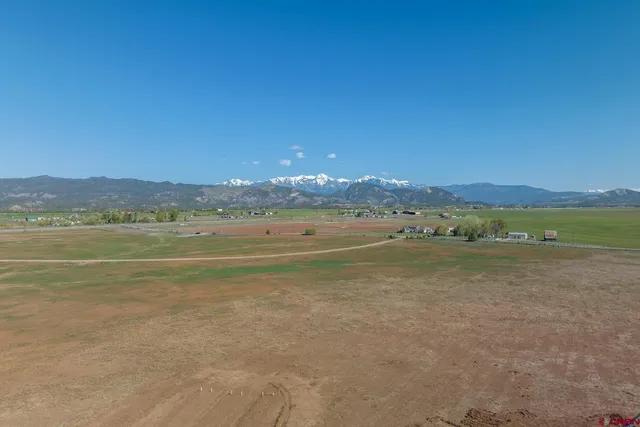 a view of an ocean with a mountain