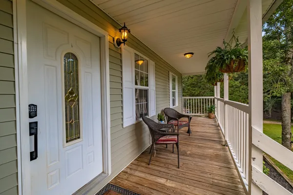a view of balcony with furniture