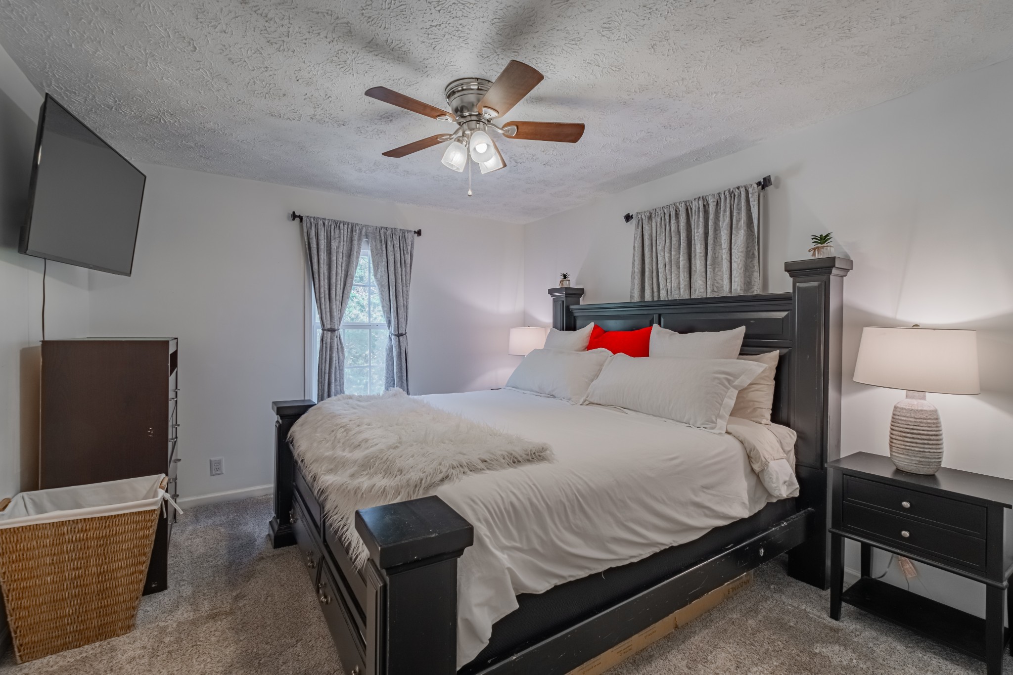 1450 Pleasant Hill Road McMinnville, TN 37110 - Photo 22 of 68 a bedroom with a bed and a flat screen tv