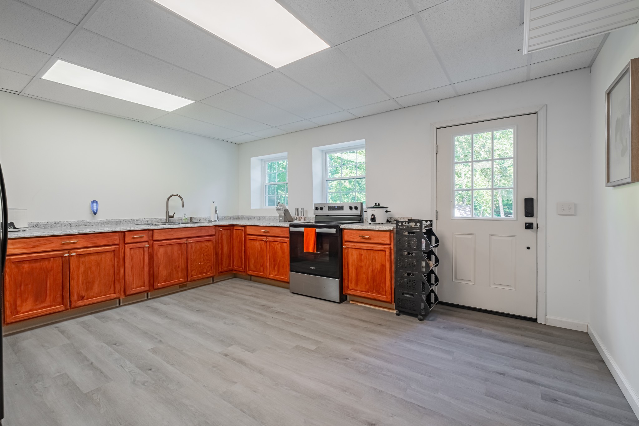 1450 Pleasant Hill Road McMinnville, TN 37110 - Photo 43 of 68 a large kitchen with wooden floors and stainless steel appliances