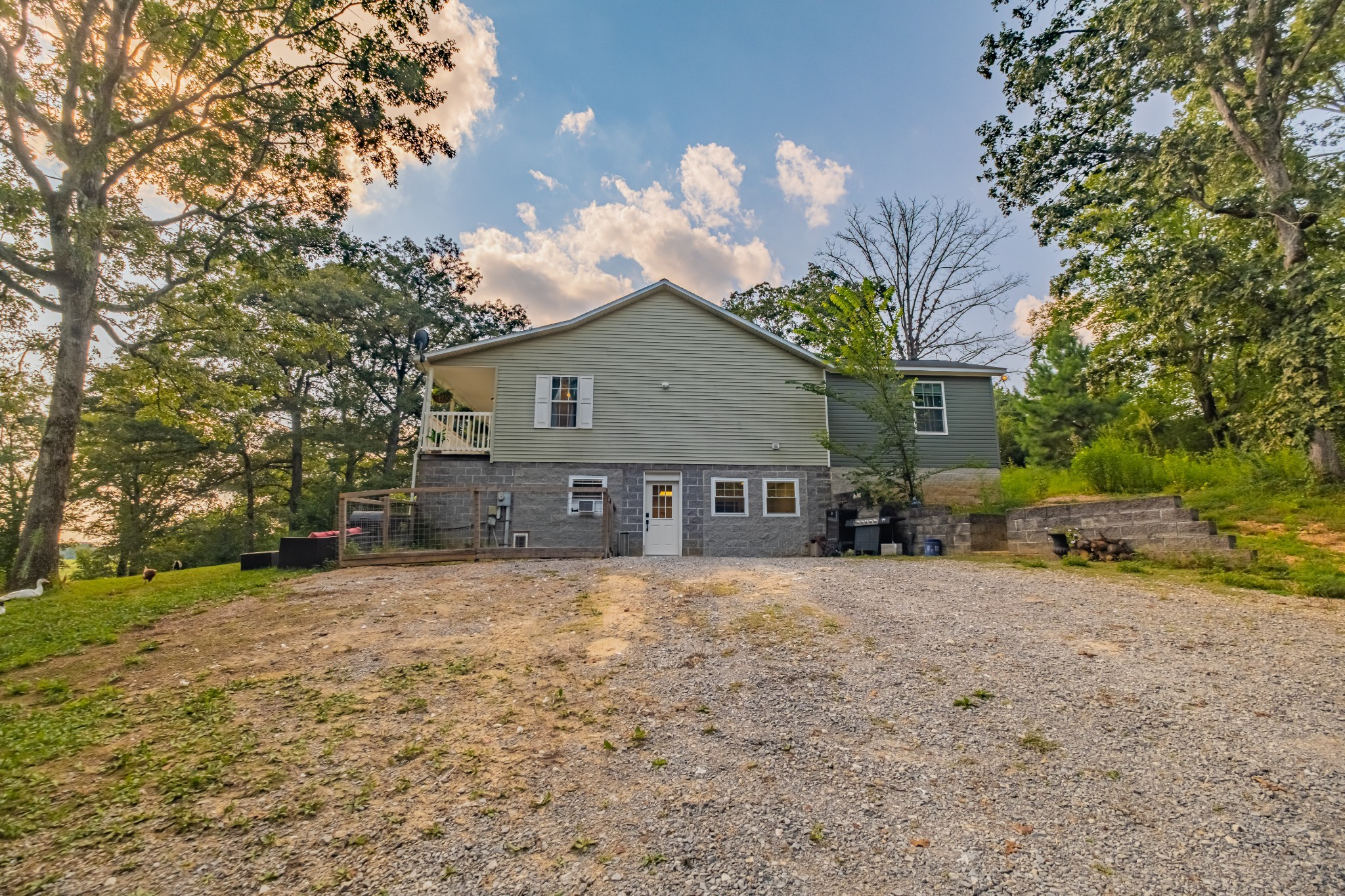 1450 Pleasant Hill Road McMinnville, TN 37110 - Photo 53 of 68 a front view of a house with a yard and garage