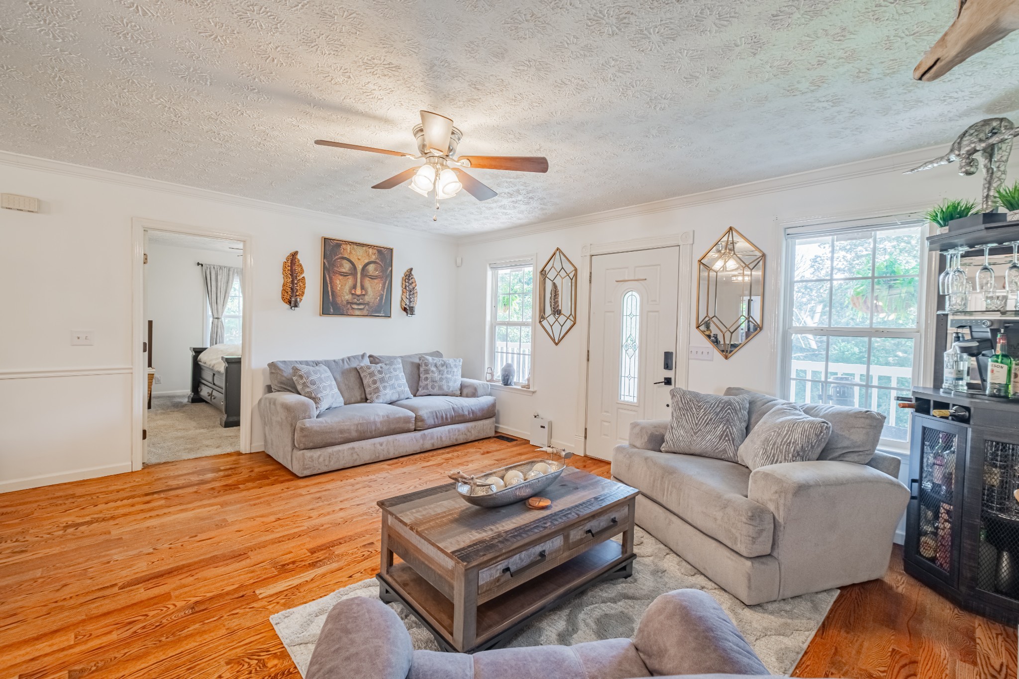 1450 Pleasant Hill Road McMinnville, TN 37110 - Photo 7 of 68 a living room with furniture a large window and a chandelier