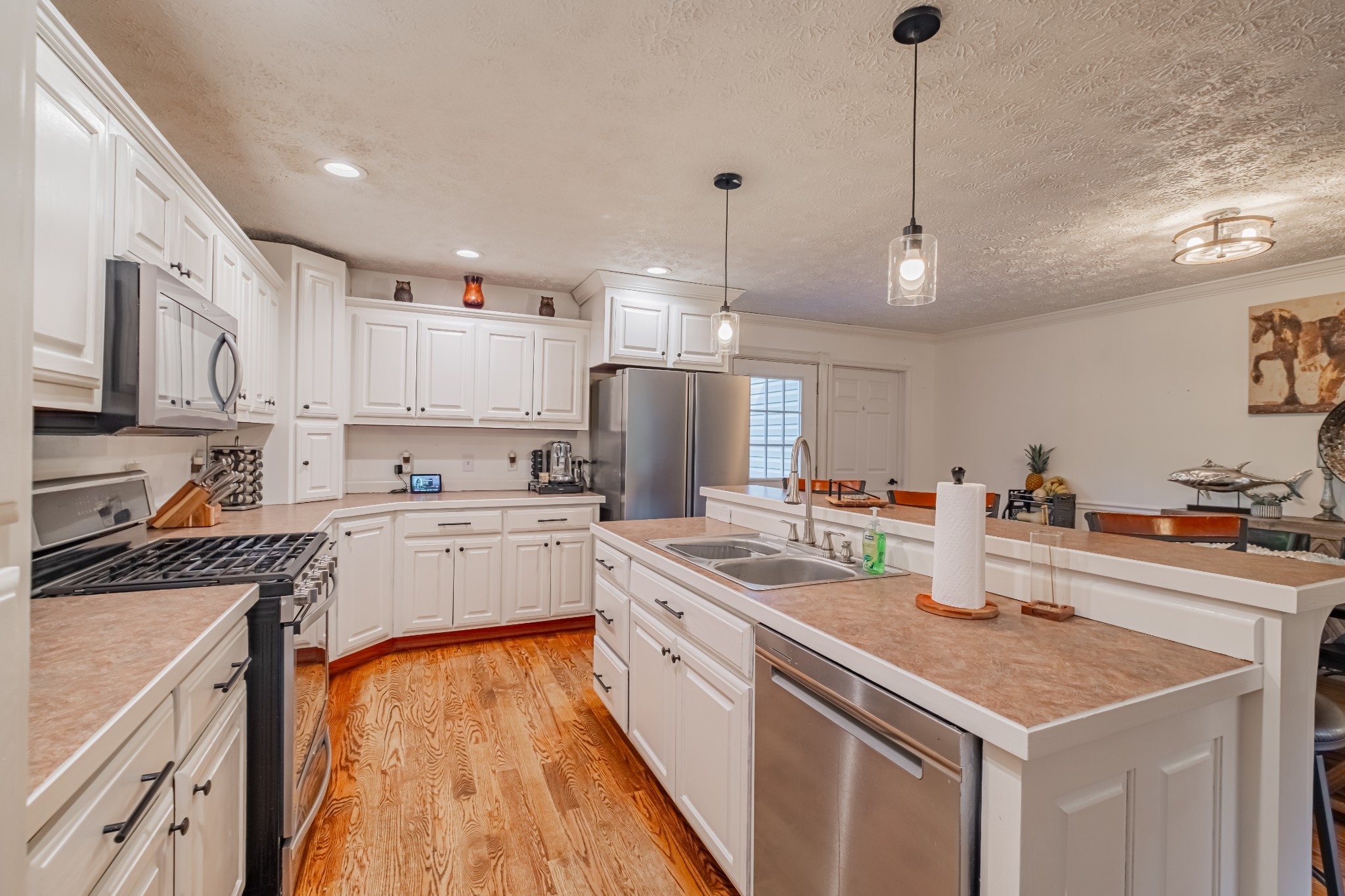 1450 Pleasant Hill Road McMinnville, TN 37110 - Photo 10 of 68 a kitchen with a sink stove and cabinets