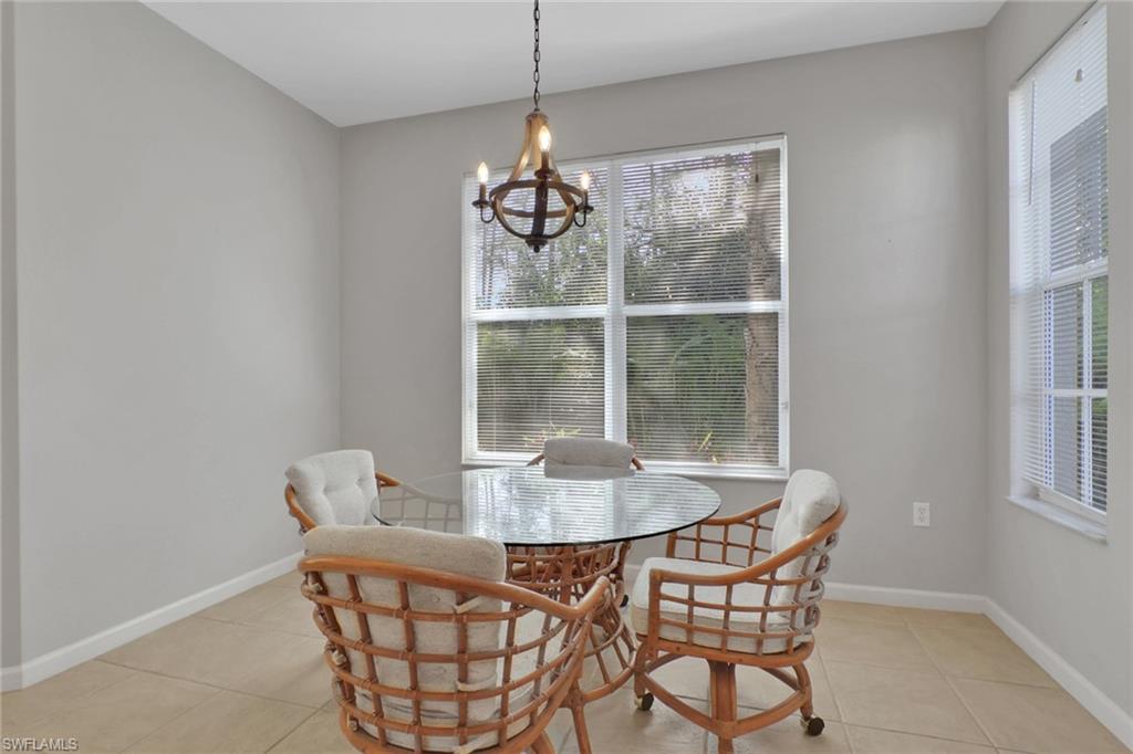 7844 Clemson Street, Unit 102 Naples, FL 34104 - Photo 11 of 31 a dining room with furniture and window