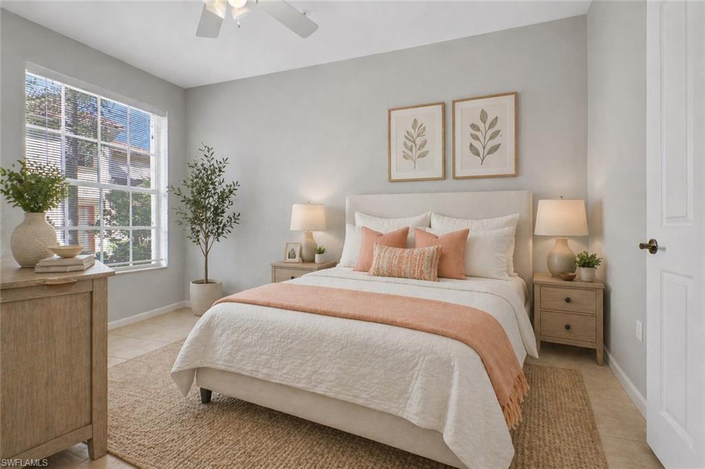 7844 Clemson Street, Unit 102 Naples, FL 34104 - Photo 18 of 31 a bedroom with a bed and a window