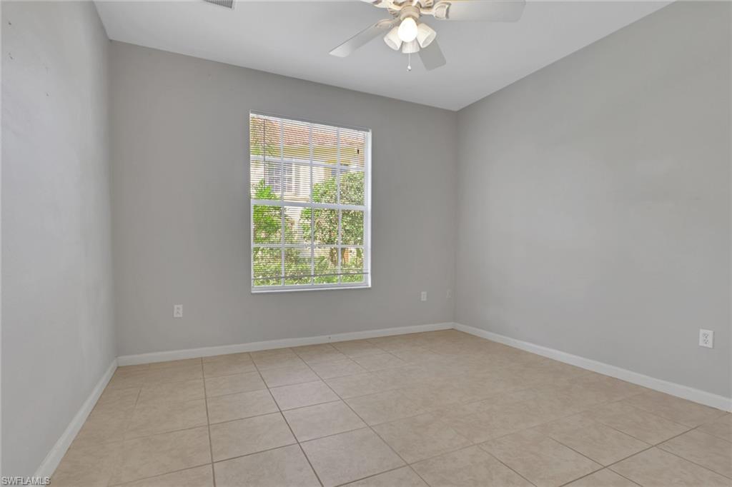 7844 Clemson Street, Unit 102 Naples, FL 34104 - Photo 19 of 31 an empty room with a window