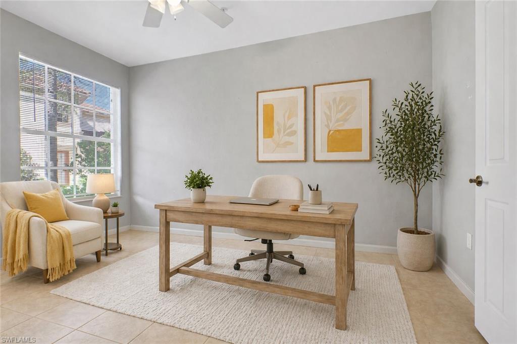 7844 Clemson Street, Unit 102 Naples, FL 34104 - Photo 21 of 31 a living room with furniture and a potted plant