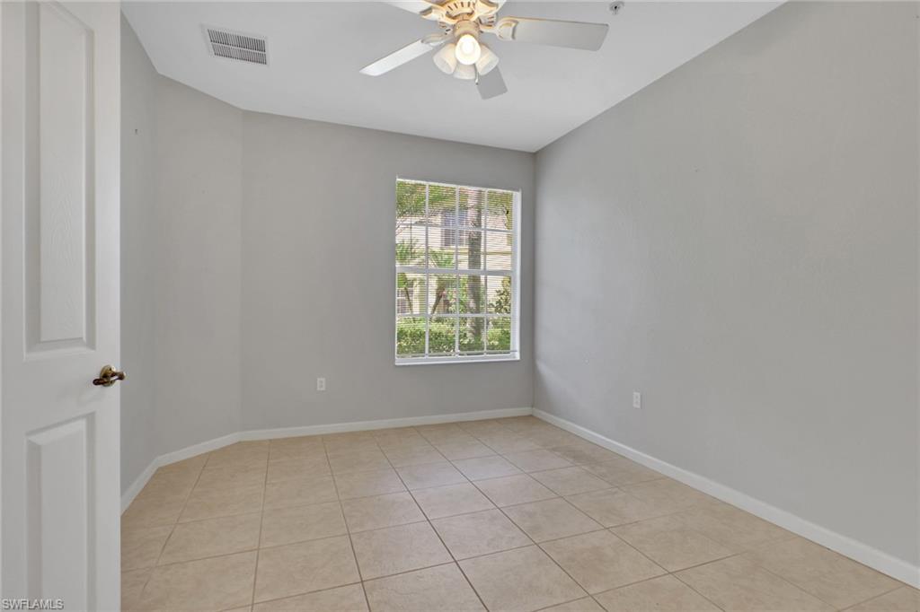 7844 Clemson Street, Unit 102 Naples, FL 34104 - Photo 22 of 31 a view of an empty room with a window