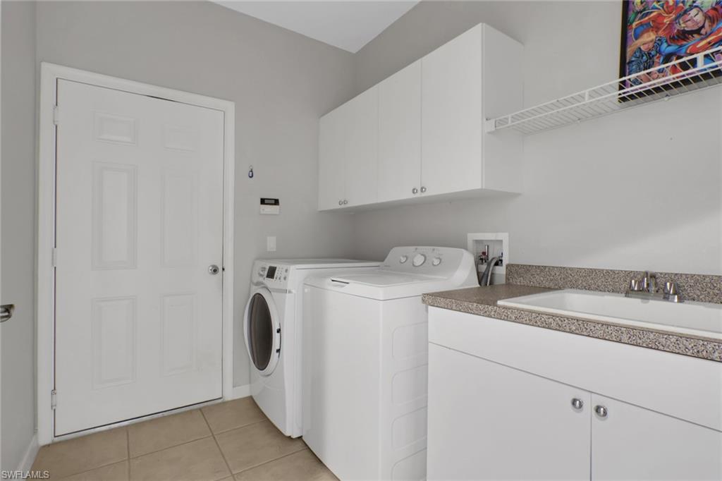 7844 Clemson Street, Unit 102 Naples, FL 34104 - Photo 23 of 31 a utility room with dryer and washer