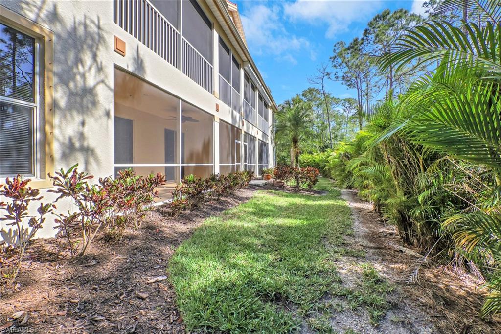 7844 Clemson Street, Unit 102 Naples, FL 34104 - Photo 26 of 31 a view of a pathway with a house