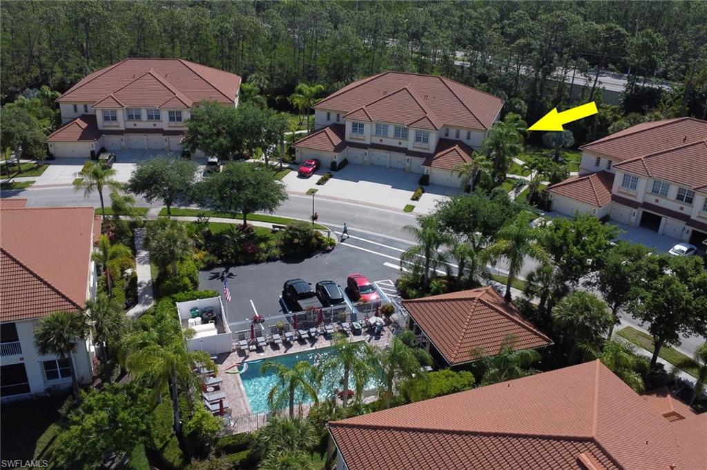7844 Clemson Street, Unit 102 Naples, FL 34104 - Photo 30 of 31 an aerial view of a house with a swimming pool yard and outdoor seating