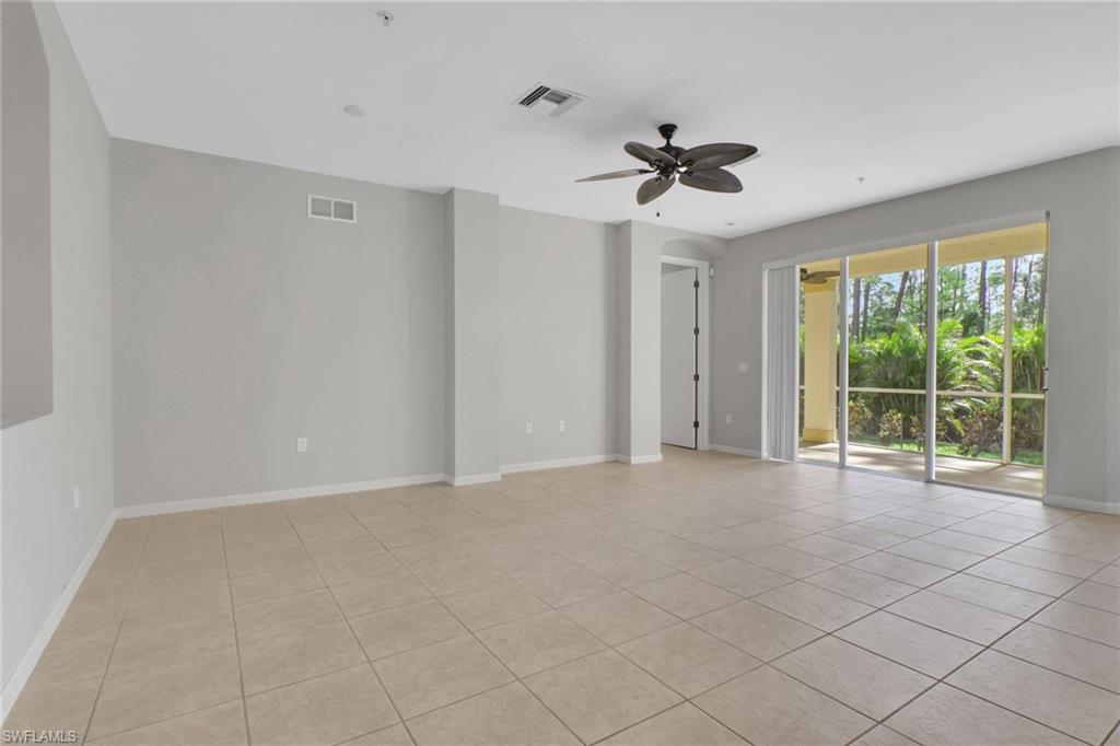 7844 Clemson Street, Unit 102 Naples, FL 34104 - Photo 4 of 31 a view of an empty room with a window