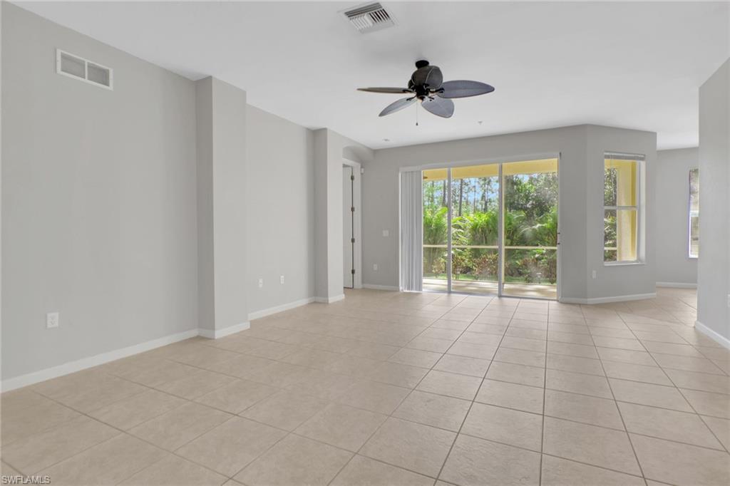 7844 Clemson Street, Unit 102 Naples, FL 34104 - Photo 6 of 31 a view of an empty room with a window