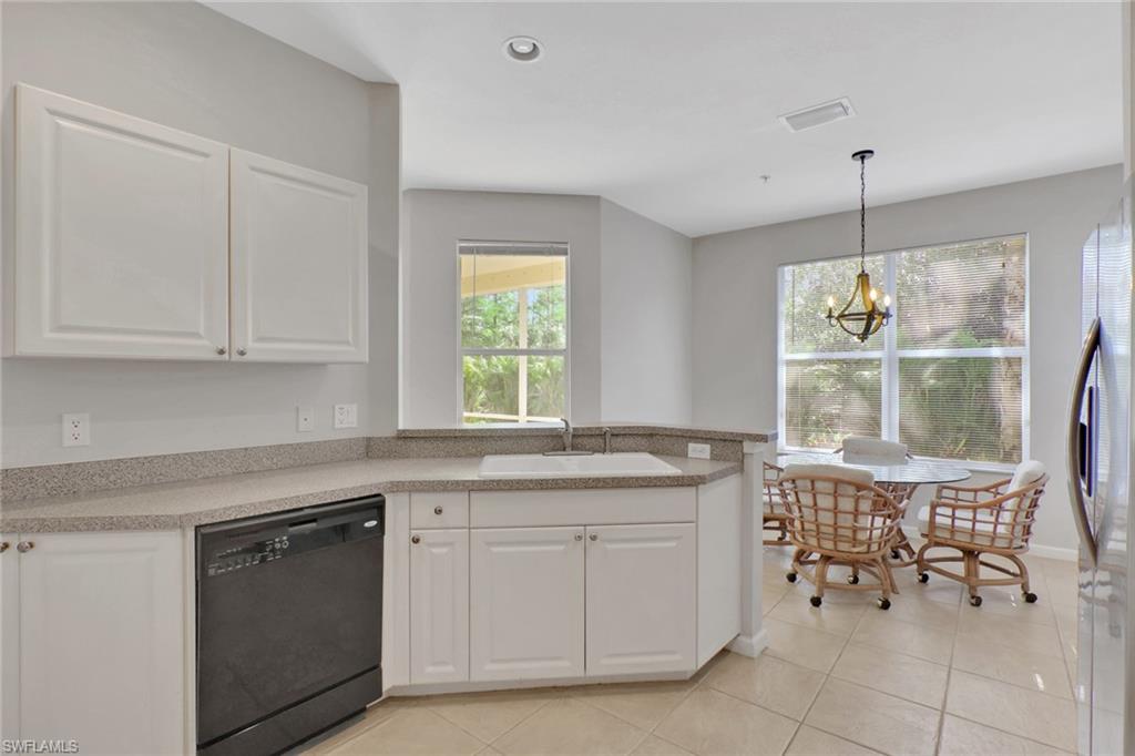 7844 Clemson Street, Unit 102 Naples, FL 34104 - Photo 10 of 31 a kitchen with a sink and cabinets