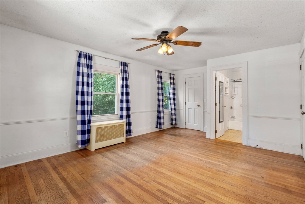 41 Nevada Street Springfield, MA 01107 - Photo 13 of 33 a view of an empty room with window and wooden floor