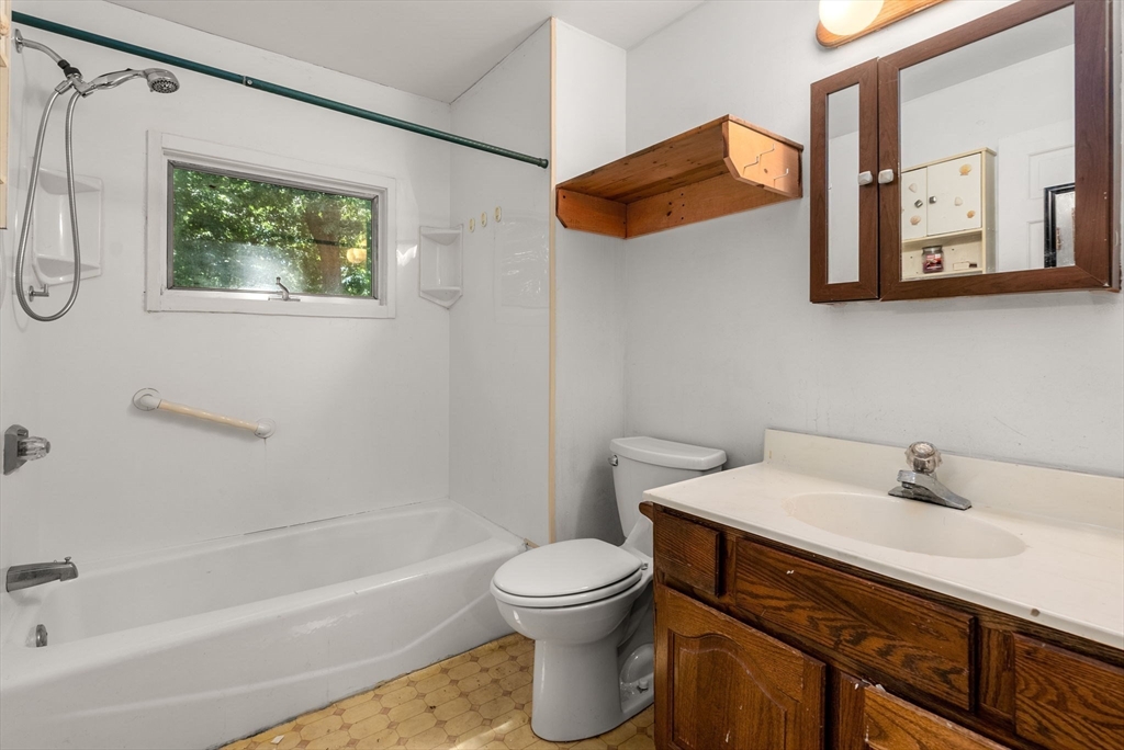 41 Nevada Street Springfield, MA 01107 - Photo 15 of 33 a bathroom with a sink a toilet and a bathtub