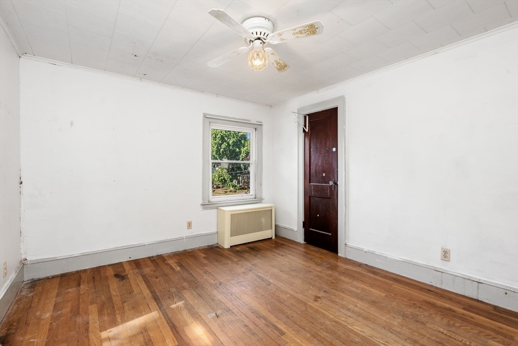 41 Nevada Street Springfield, MA 01107 - Photo 20 of 33 wooden floor in an empty room with a window