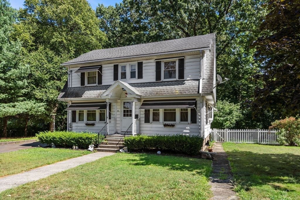 41 Nevada Street Springfield, MA 01107 - Photo 28 of 33 a front view of a house with a yard and green space