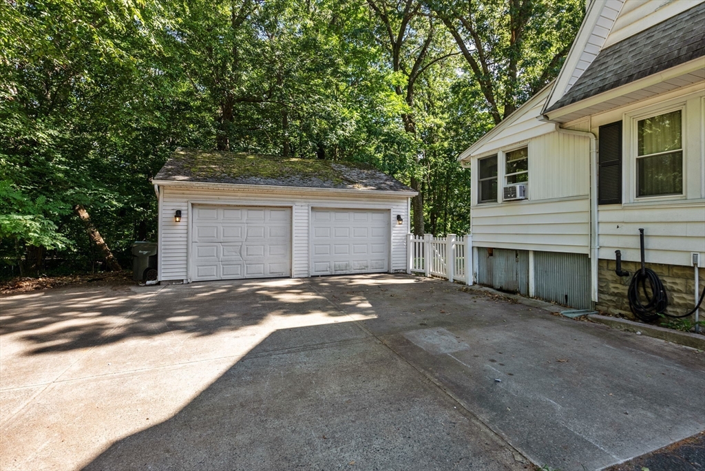 41 Nevada Street Springfield, MA 01107 - Photo 4 of 33 a view of a house with a yard and garage